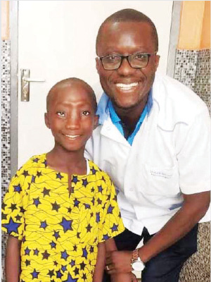 Samuel and Dr Alvin Nah Doe, a KBNF member and Liberia’s sole neurosurgeon, who participated in Samuel’s surgery and treatment.