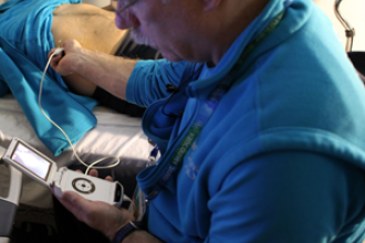 Dr. Ross Brown using a pocket sized ultrasound at Vancouver Olympics 2010