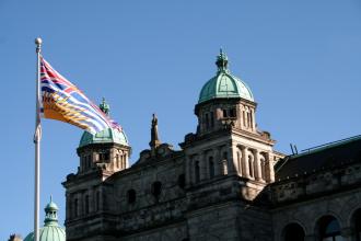 The Parliament of British Columbia and the provincial flag