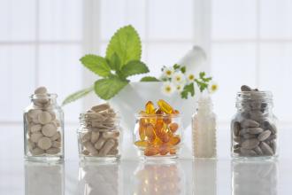 Different types of vitamins in glass jars