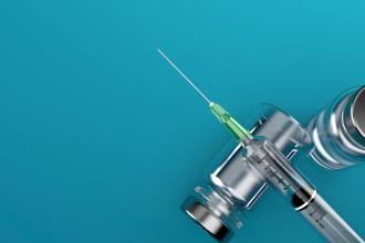 A vial of insulin and a syringe