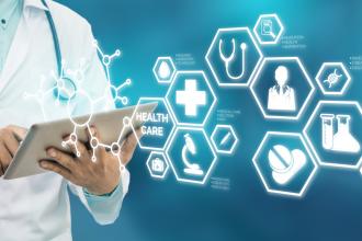 A collection of medical icons superimposed over a doctor holding a tablet