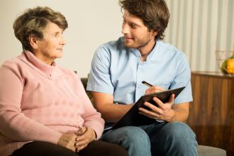 A doctor talks to an overweight patient