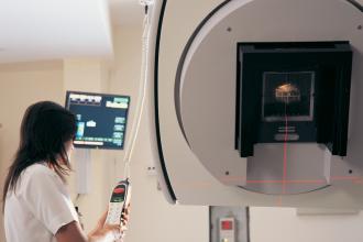A technician uses a linear accelerator