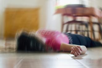 Woman lying on her back on the floor with a swirling effect overlay 