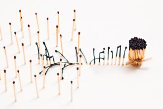 The concept of social distancing using matchsticks; some are in a bundle, while others are spread out