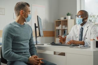 A doctor consults with a patient
