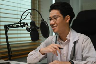 A doctor records a podcast