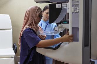 A woman is getting a mammogram.