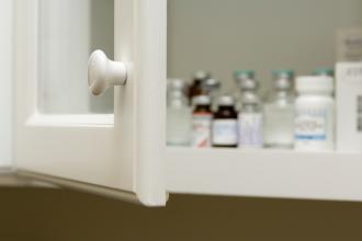 A medicine cabinet with one door ajar.