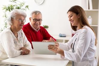 Healthy elderly couple, happy doctors