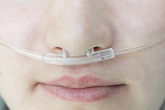 Woman with a respiratory nasal catheter