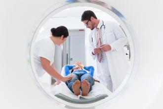 Doctor, nurse, and patient at CT scan