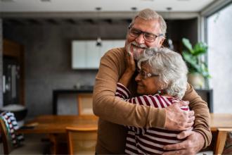 Senior couple hugging