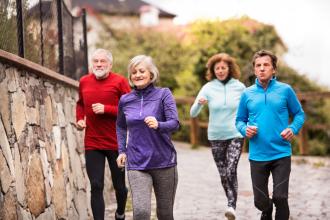 Group of seniors running outdoors in the old town.