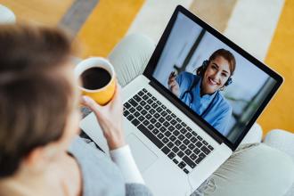 Doctor having video call with patient who is calling her from home