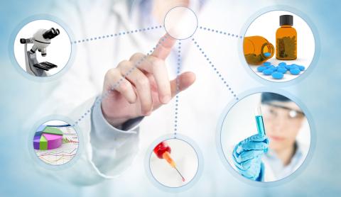A doctor works on a whiteboard with different medical-related icons