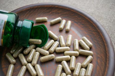 Biotin capsules on a clay plate