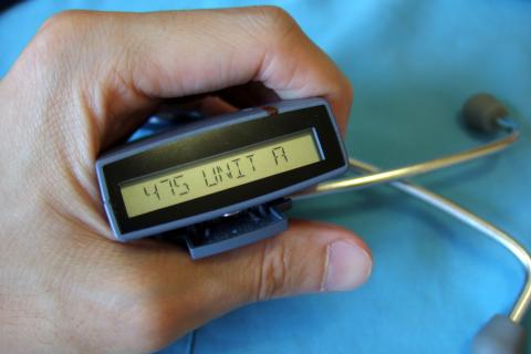 A pager is shown next to a stethoscope