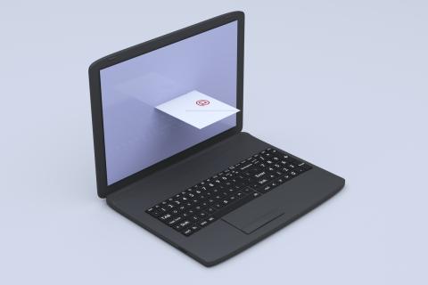 An envelope comes out of a laptop screen as if it were a mail slot