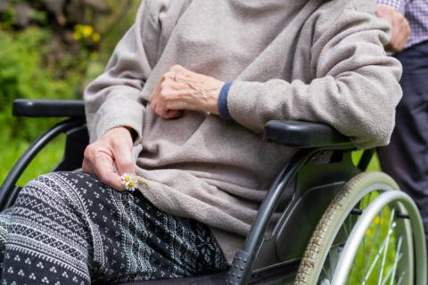 A senior sits in a wheelchair