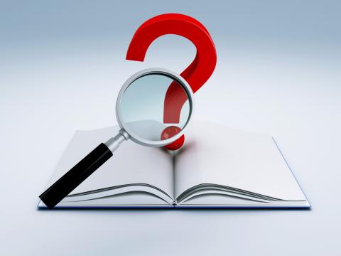 A book with a question mark and a magnifying glass