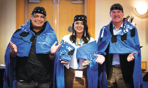 Mr Rain Pierre, Dr Ramneek Dosanjh, and Dr Alan Ruddiman participate in an honorary blanket ceremony for the work they have accomplished in advancing cultural safety in health care.