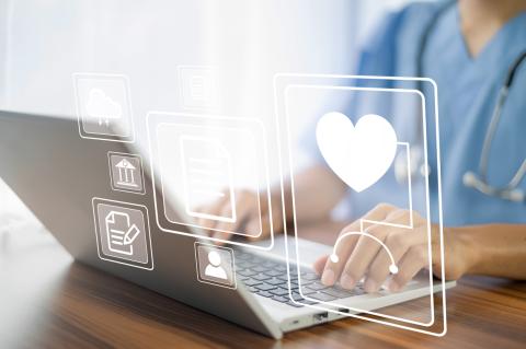 Medical icons overlaid on a doctor working on a laptop.