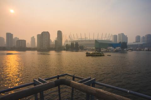 The Vancouver skyline with a hazy sky.