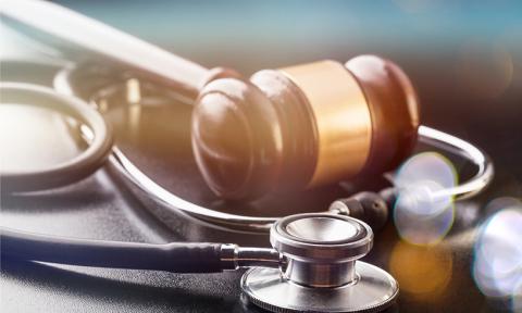 Judge gavel and stethoscope in close-up