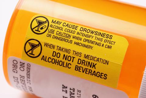 Prescription bottle with drug warnings