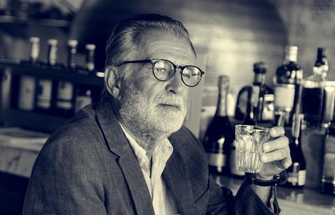 Senior Man Hangout Drinking Alcohol in a Pub