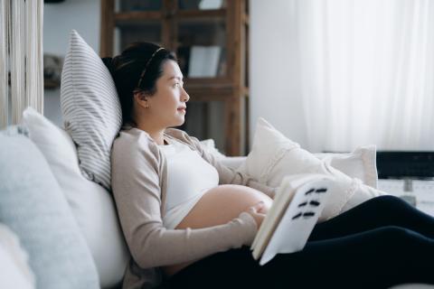 Pregnant person deep in thought