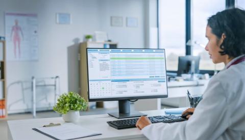 Doctor accessing EMR in clinic