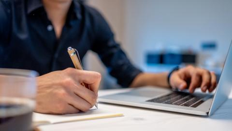 Physician working on a laptop