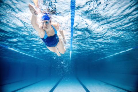 Woman swimming in Olympic pool