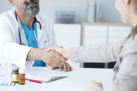 Doctor shakes hands with a patient