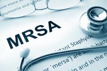 A fact sheet on MRSA with a stethoscope and a pair of glasses on top
