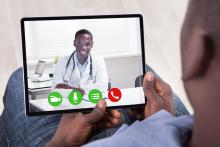 A doctor and patient have a virtual consultation