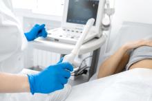 An ultrasound technician prepares for an ultrasound