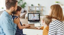 A family consults with their doctor by videoconference