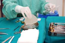 A table with surgical tools and breast implants