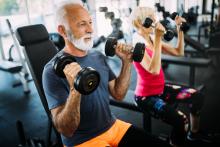 Seniors are lifting weights at a gym