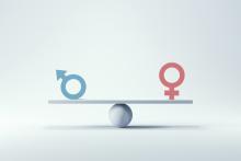 A platform is balanced on top of a ball, with a male symbol on one end and a female symbol on the other end.