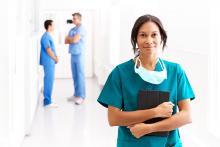 Female doctor walking down a hospital corridor