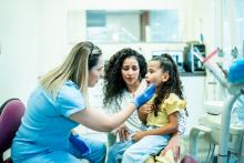 Mother and daughter a dentist's appointment