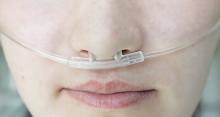 Woman with a respiratory nasal catheter