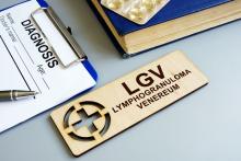 Wooden sign of lymphogranuloma venereum (LGV) and diagnostic form with clipboard